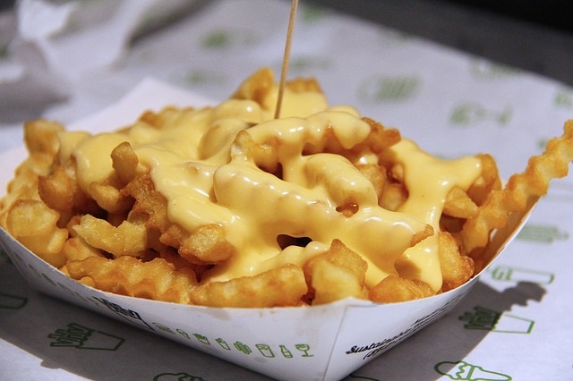 Empty Calories Can Pile on the Pounds - Tips from Healthy Diet Habits. Pictured: French Fries with Nacho Cheese Sauce